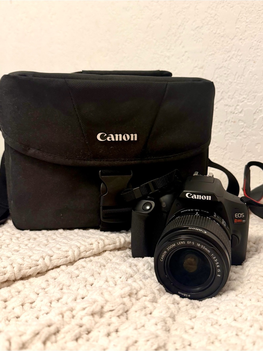 Canon DSLR Camera with Zoom Lens and Black Carrying Bag